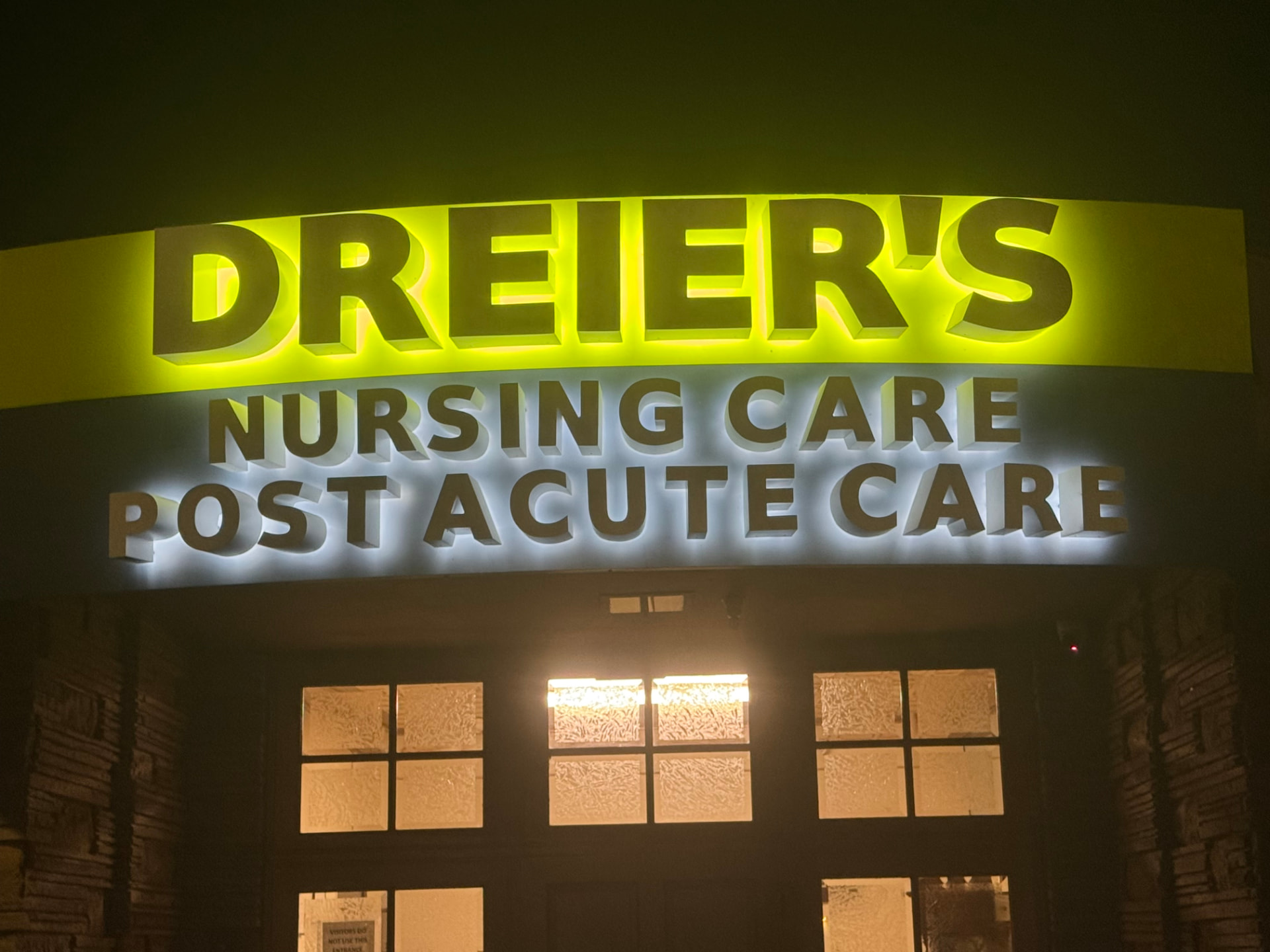 Illuminated Dreier's Nursing Care and Post Acute Care dimensional letters glowing at night