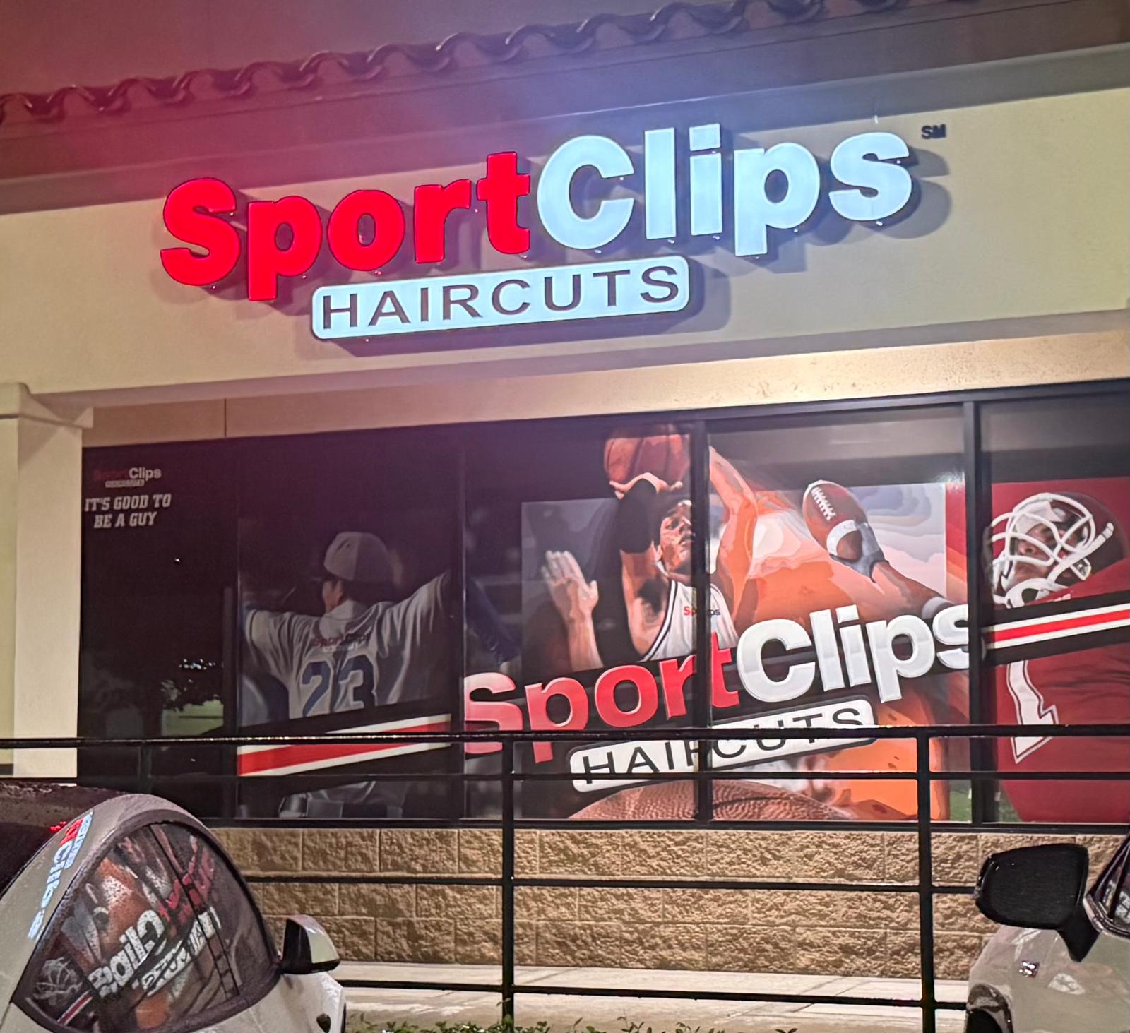Sport Clips Haircuts storefront with red and white dimensional channel letters and a black Haircuts panel above the entrance